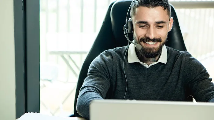 Admissions staff working on a laptop at a drug and alcohol rehab in Derbyshire Admissions staff working on a laptop at a drug and alcohol rehab in Derbyshire