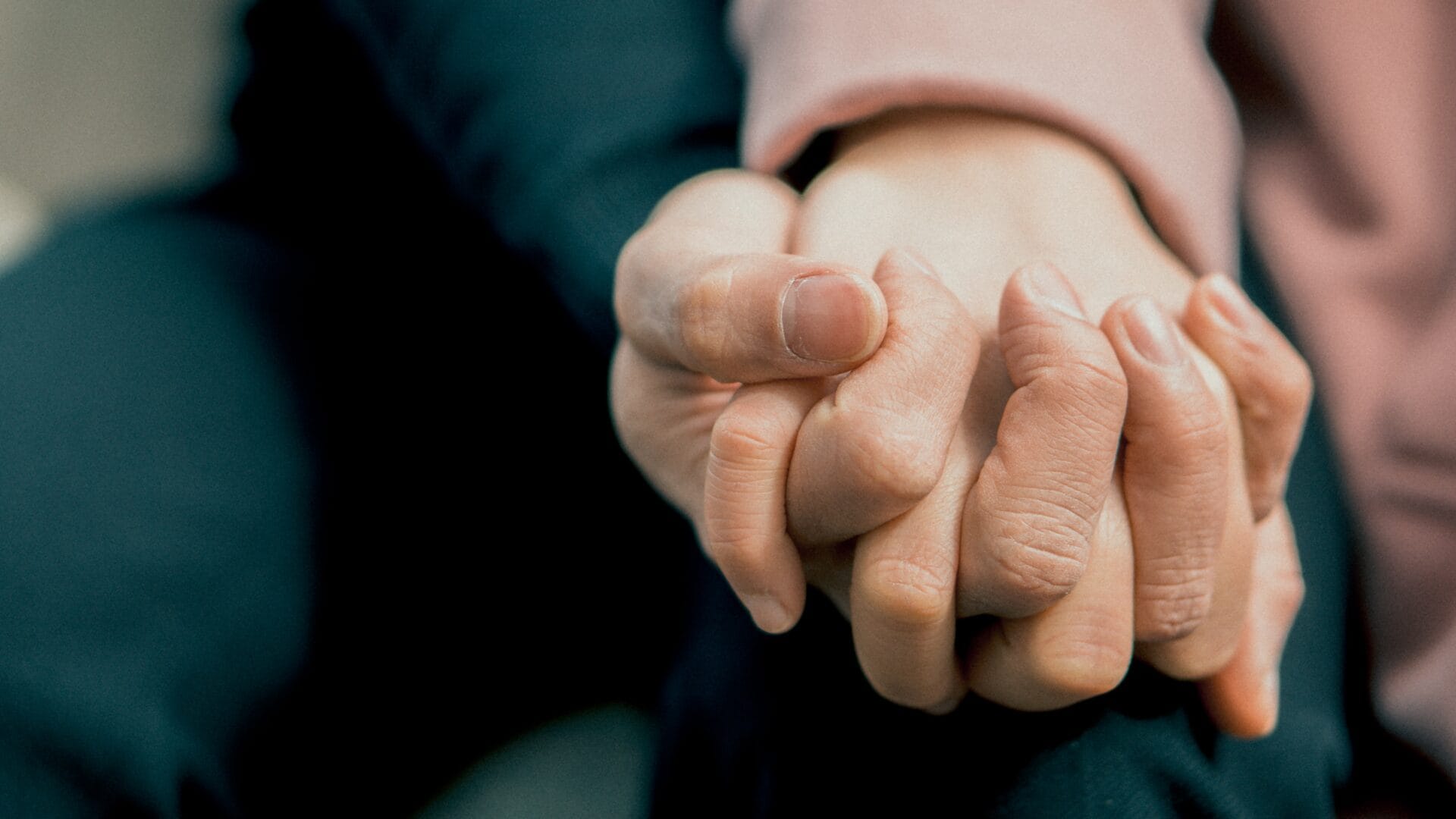 Couple holding hands at a drug and alcohol rehab clinic in Gloucester