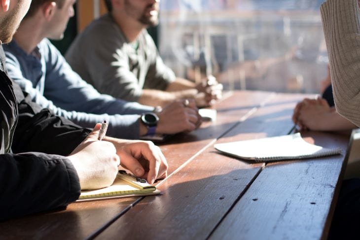 Group of people taking notes together at a drug and alcohol rehab clinic in Portsmouth or near Portsmouth