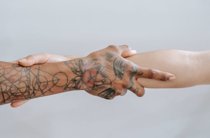 People holding hands at a drug and alcohol rehab in Cornwall