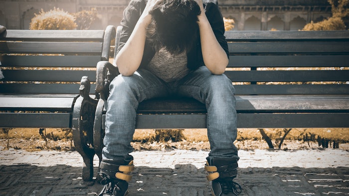 Person alone on bench