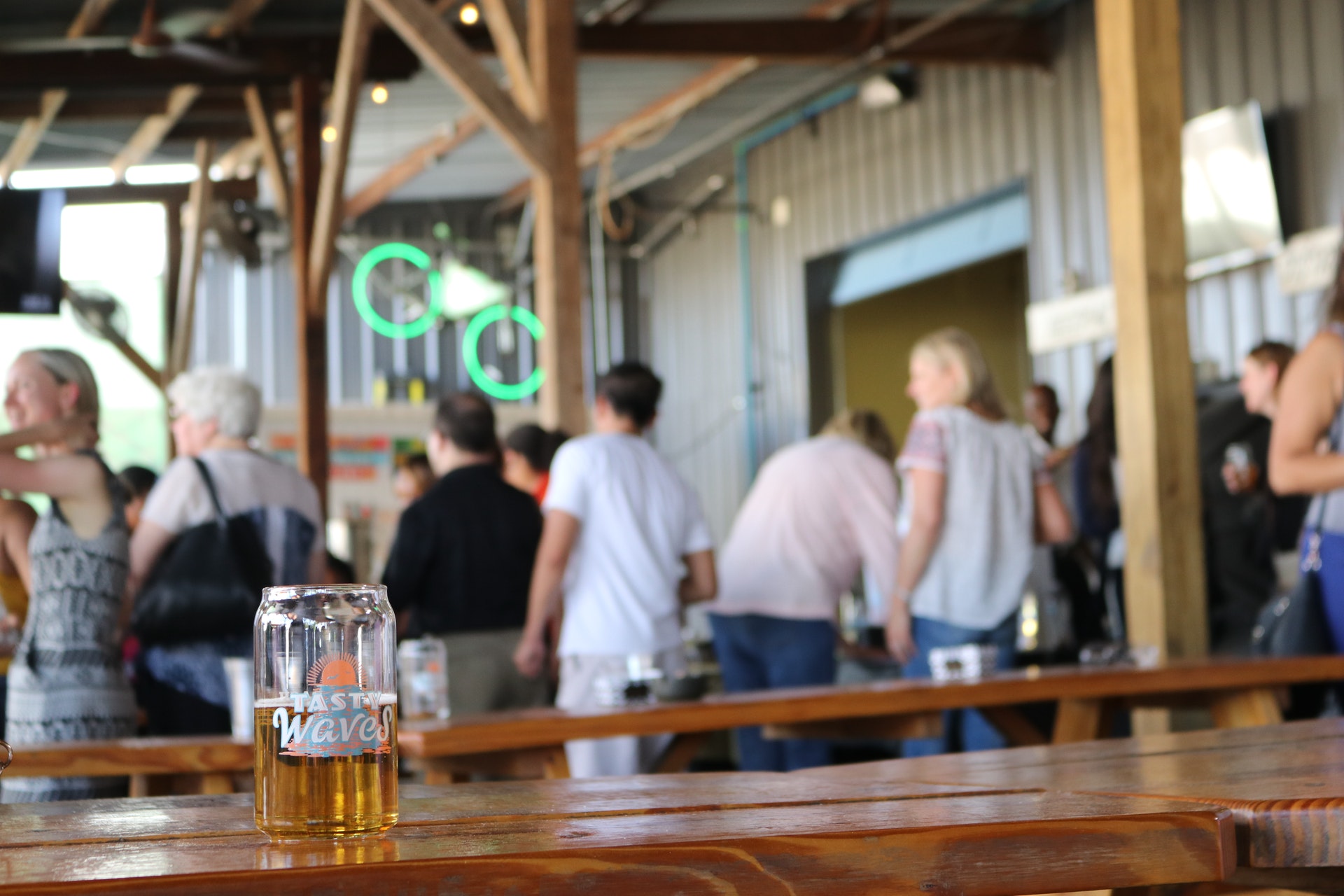 The outside of a bar with people inside