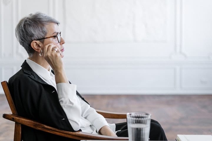 Therapist sat in a chair at drug and alcohol rehab in Cornwall or near Cornwall