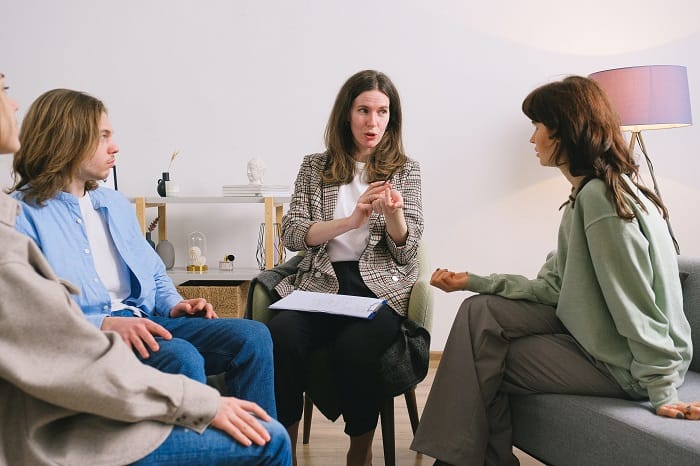 Therapy group talking together at a drug and alcohol rehab clinic in Gloucestershire