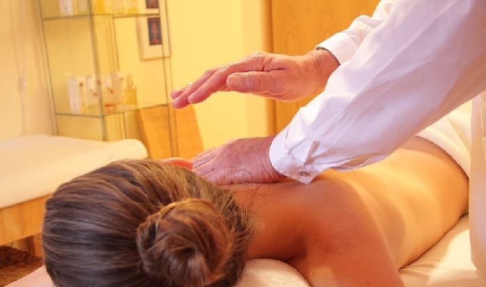 Woman receiving a massage during holistic therapy at a drug and alcohol rehab in Herefordshire