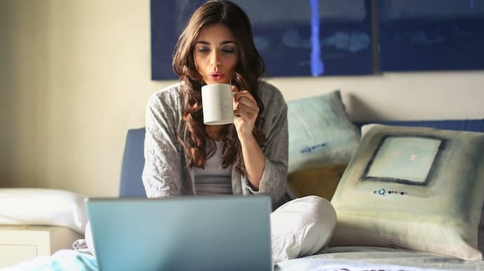 Woman drinking from a mug breaking her fast during Ramadan