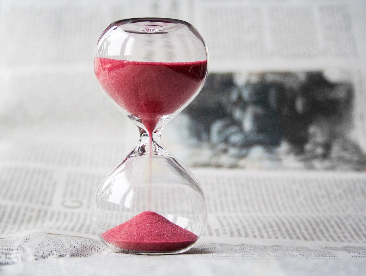 hourglass and newspaper