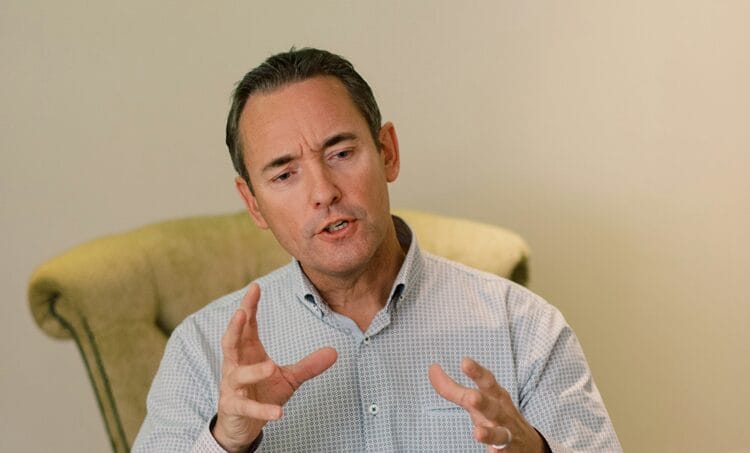 A male therapist gesticulating during motivational interviewing
