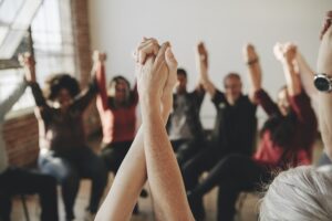 Group therapy - hands in air