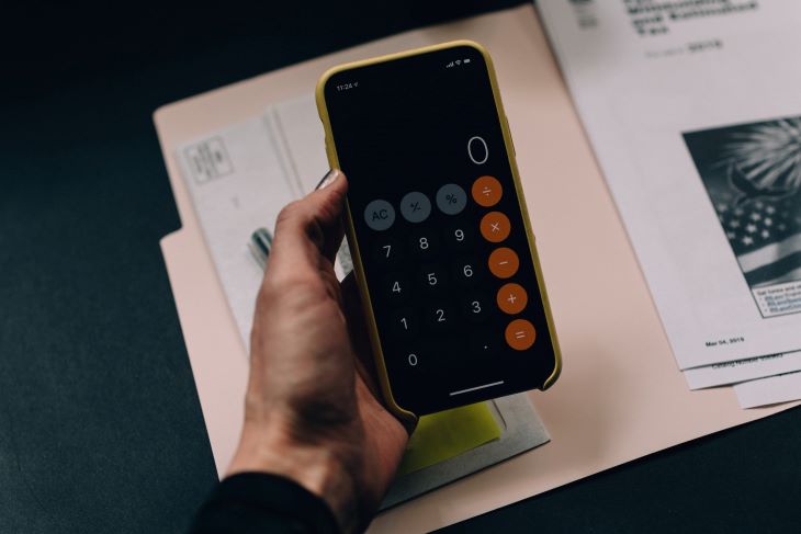 A phone calculator and admission forms