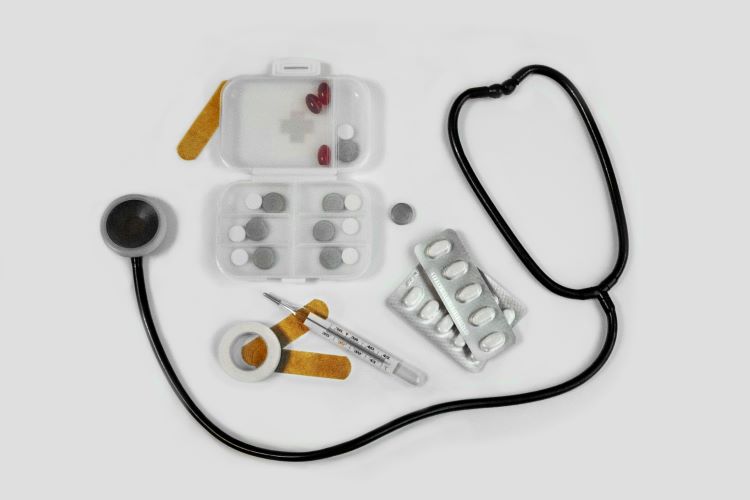 A stethoscope, pill packets and plasters