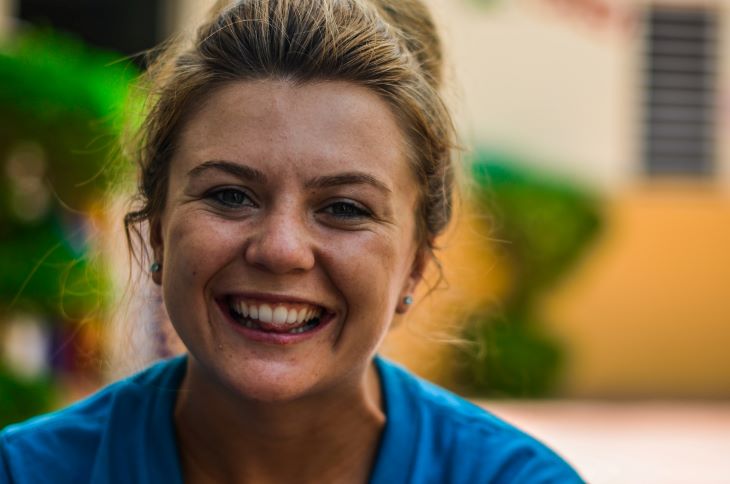 A woman smiling