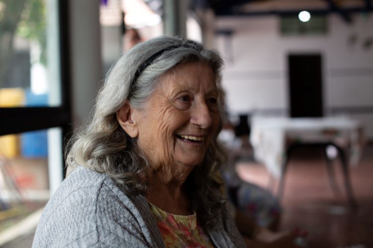 Older woman in the dining room of a treatment centre for her narcotic addiction treatment