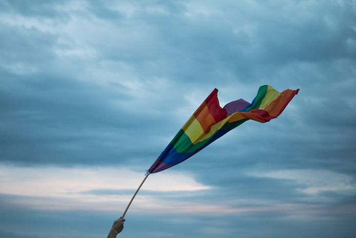 Gay pride flag being waved
