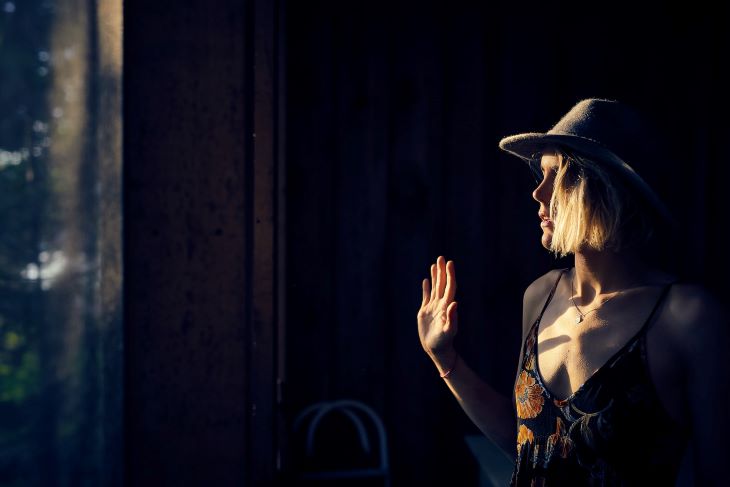 A woman with her hand up