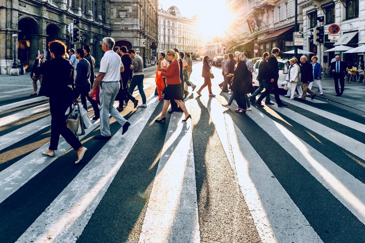 A crowd at a zebra crossing
