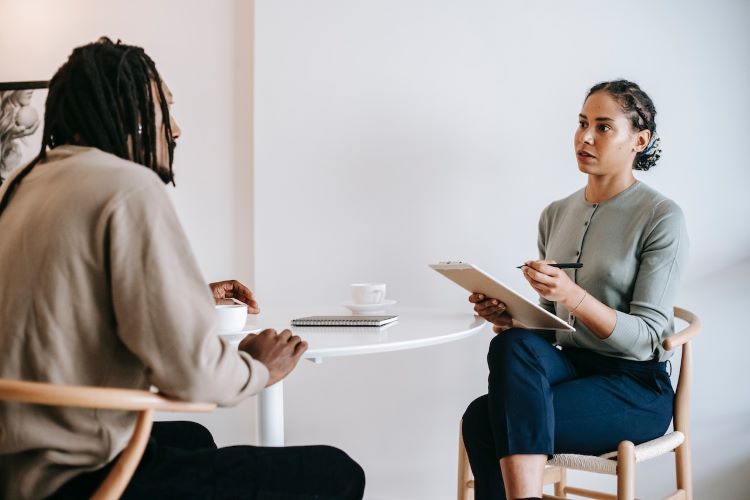 Man in therapy with a female therapist