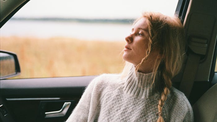 A woman in a car suffering from ketamine addiction