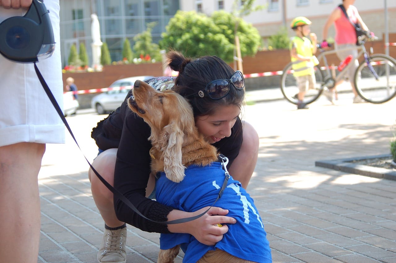 Addiction sufferer hugging their therapy dog