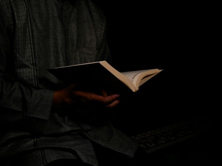 A man reading the Quran during Ramadan
