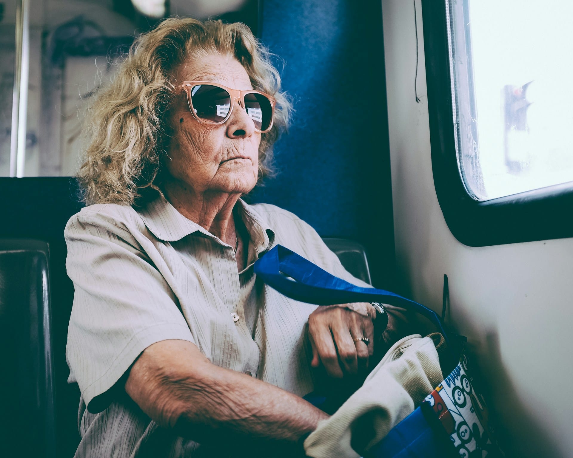 An older woman on a bus