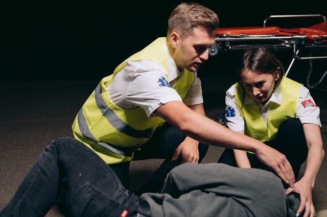 Paramedics treating a patient for alcohol withdrawal symptoms after quitting cold-turkey