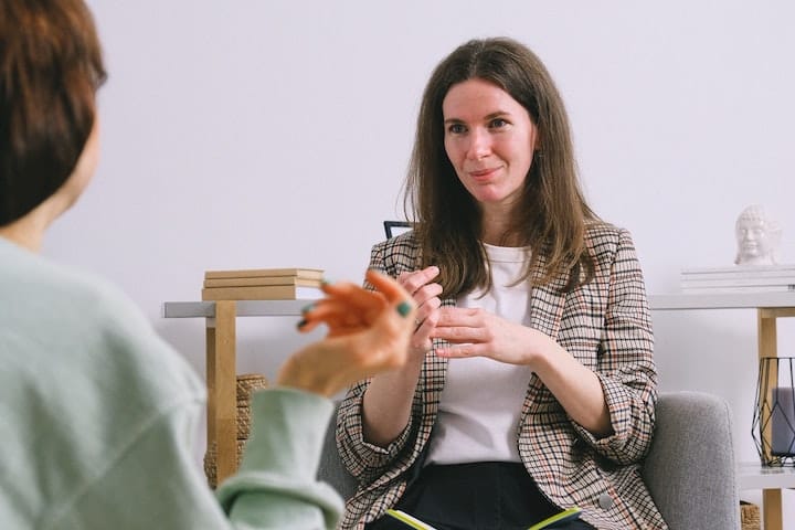 Woman listening to a family member or friend discussing their mental health