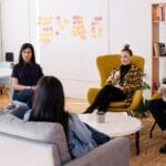 Group therapy session discussing how gay pride helps addiction recovery