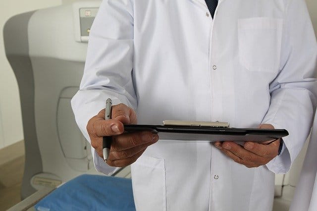 Doctor at a drug rehab making notes for pink cocaine treatment