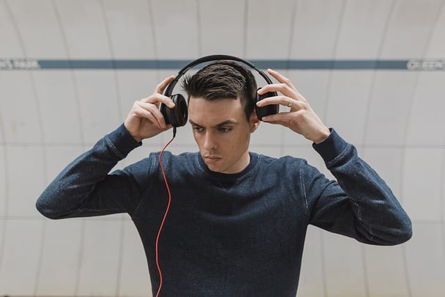 Man engaging in music therapy at rehab