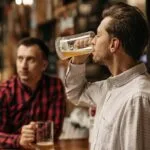 A man drinking alcohol - can Ozempic reduce alcohol cravings?