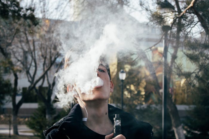 Someone vaping a single use vape