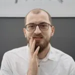 Someone who uses snus, touching their mouth